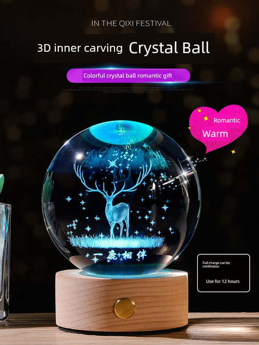 3D inner carving crystal ball with deer design, glowing with romantic light, set on a wooden base.